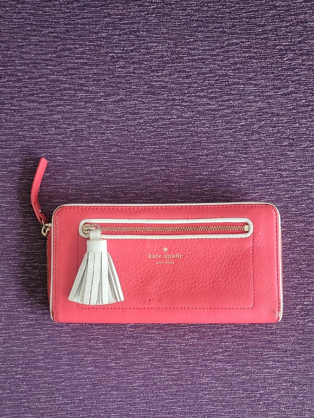 kate spade Coral Pink Leather Zip Wallet with White Tassel